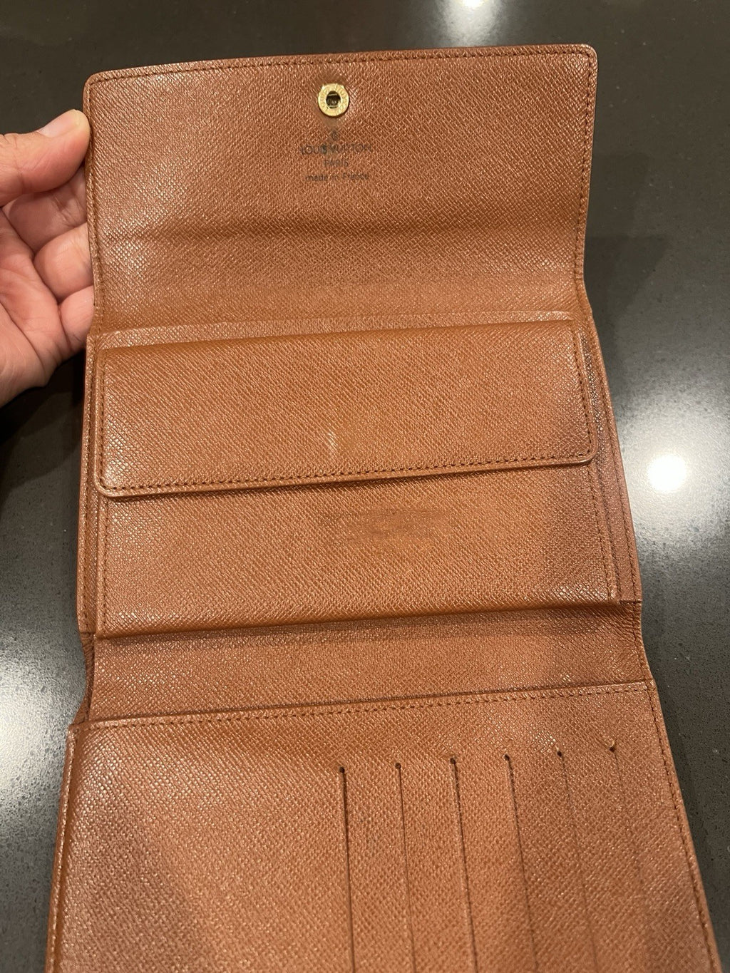 Louie Vuitton Monogram trifold wallet. Shows wear.