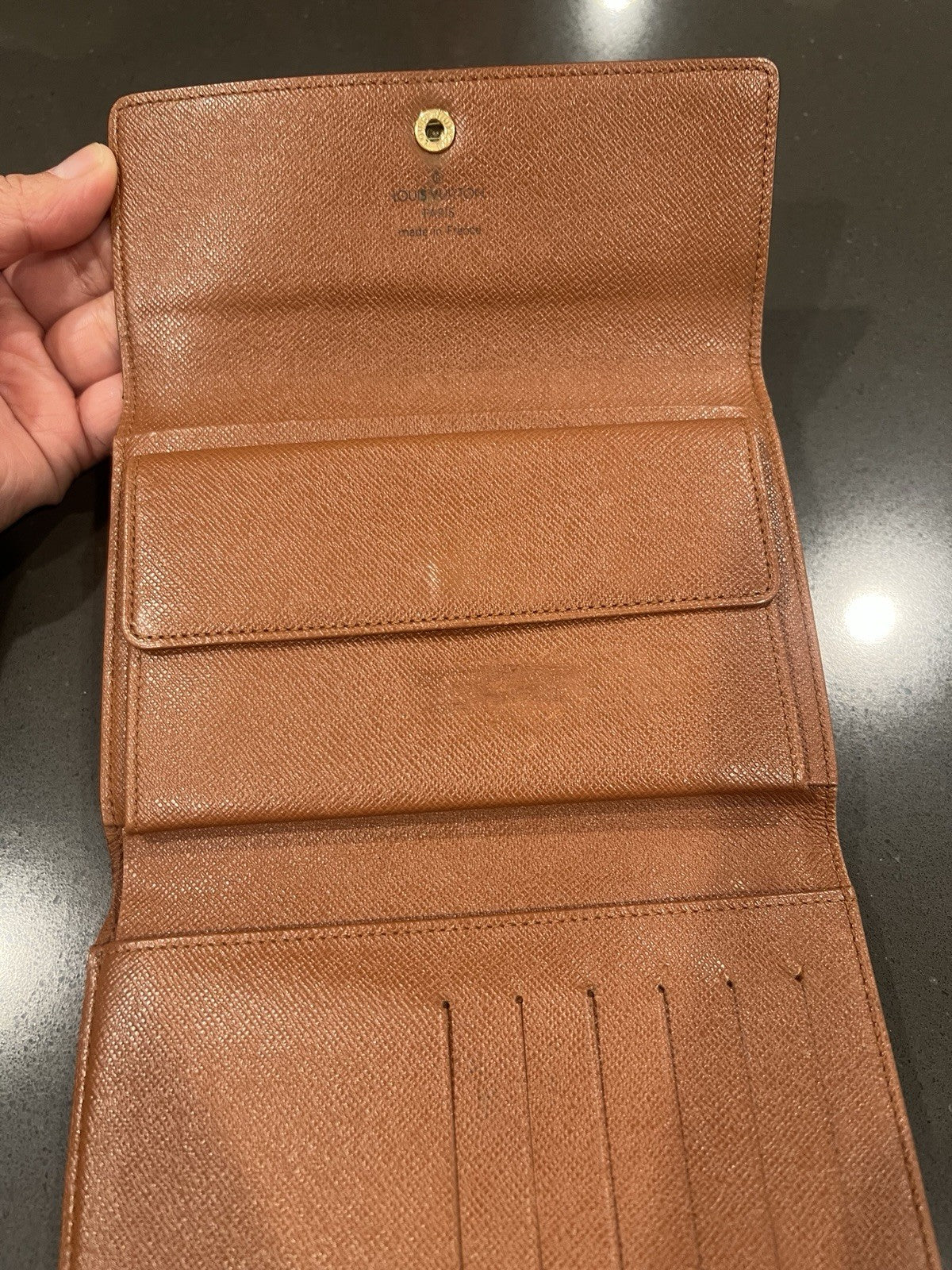 Louie Vuitton Monogram trifold wallet. Shows wear.